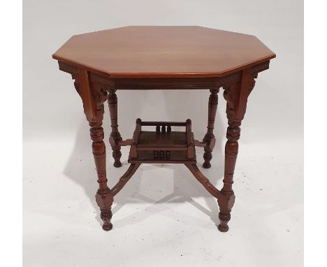 Late 19th/early 20th century walnut octagonal centre table on turned supports with shaped undertier, the whole on brown china