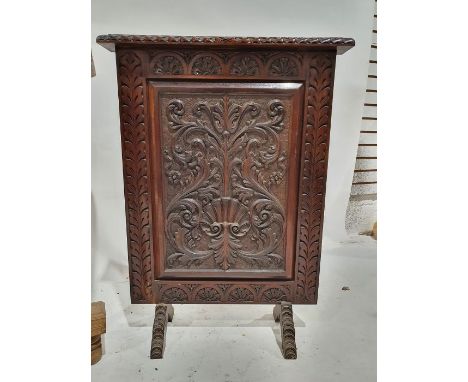 20th century oak firescreen with carved scrollwork decoration
