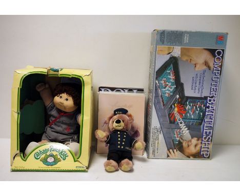 Small quantity of toys to include Computer Battleship, Hilton Steiff teddy bear, 2 Cabbage Patch Kids, and magazines on dolls