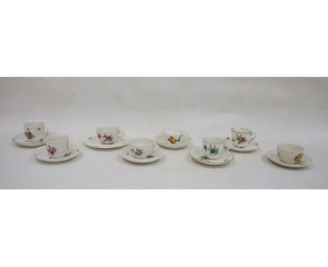 Seven assorted Nymphenburg cabinet teacups and saucers, each with foliate decoration, and one further mismatched teacup and p