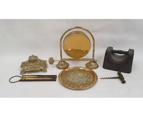 Brass table gong, a brass inkwell of square form with scrolling floral decoration and various other items of metalware