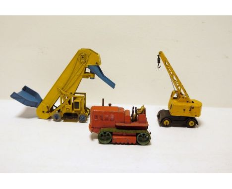 Three diecast Dinky toys to include Supertoys Coles mobile crane, Supertoys Barber-Greene folding elevator loader, Supertoys 