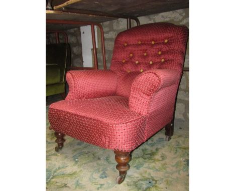 A Victorian drawing room chair with swept and rolled arms, lattice patterned plum ground upholstery, button back, raised on t