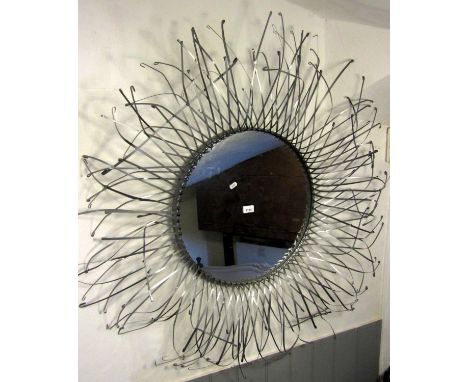 A contemporary sunburst light metal framed wall mirror of circular form with lattice strapwork surround, the mirror plate 50 