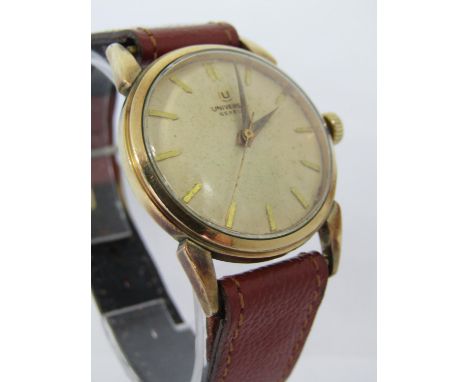 Vintage gent's universal gold plated dress watch, with convex gilt dial and gilt baton markers upon an associated leather str