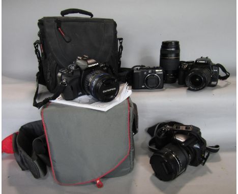 Good collection of cameras to include Canon Powershot G9 and charger, Canon EOS 400D with EFS 18-55 lens, 75-300 lens and cha