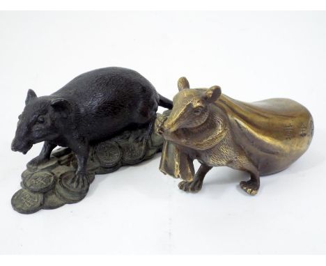 A Japanese bronze figure of a rat hauling a heavy sack, and a further rat standing of a pile on coinage, 17cm long and smalle