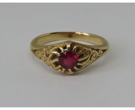 Claw set ruby solitaire ring in unmarked yellow metal with scrolled shoulders, size N, 4g 