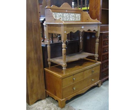 A Victorian style stripped pine washstand with transfer printed tiled splashback and turned supports together with a low thre