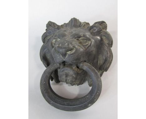 Good quality cast metal lion head door knocker with faceted ring handle 