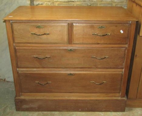 A vintage stripped pine kitchen cabinet, partially enclosed by a pair of rectangular glazed panelled doors with chamfered det