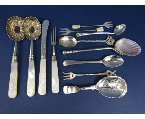 A quantity of novelty sterling English silver spoons to include a caddy spoon, an interesting preserve spoon with shell bowl 