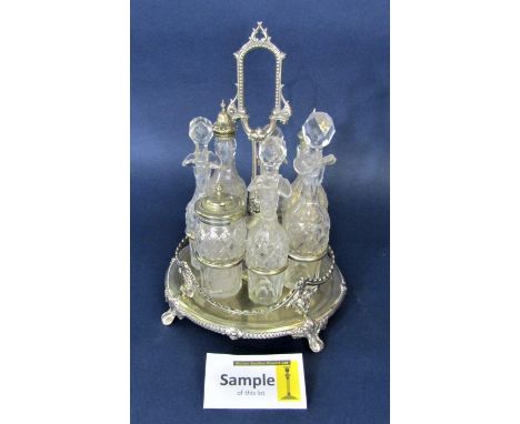 Silver plate and cut glass bottle cruet comprising seven glass vessels, together with a further rope twist woodwork barometer