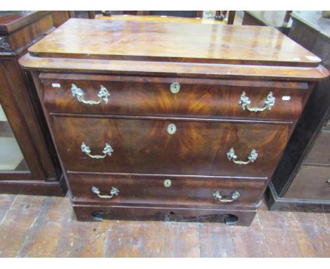 A 19th century continental commode of three long drawers with shaped outline, cast brass fittings, raised on bracket supports