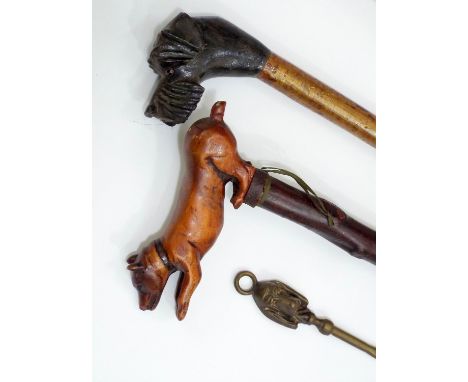 19th century walking stick, the handle in the form of a playful dog, further walking stick in the form of a terrier with glas