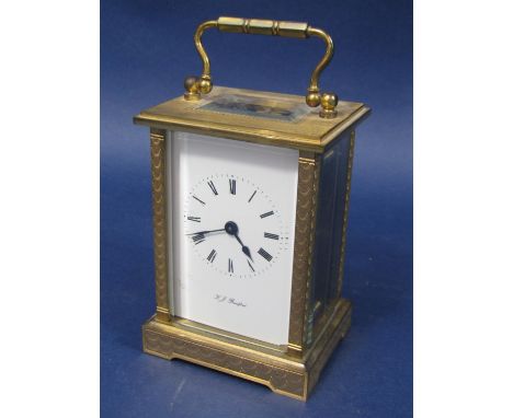 Engine turned brass cased carriage clock by K J Bradford, 11cm high 