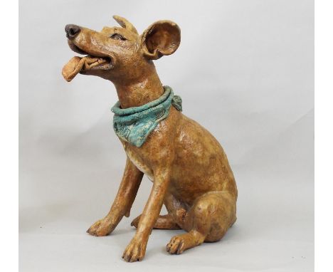 A studio pottery figure of a terrier wearing a scarf, in seated pose, by Joanna Cooke, 32cm high 