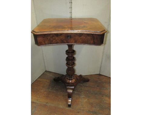 A 19th century continental mahogany sewing box, the front elevation of concave form, raised on a complicated turned pillar an