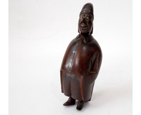 A 19th century carved snuff box in the form of a rotund male character wearing a night cap, 10cm high 