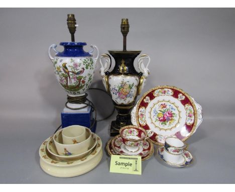 A collection of Royal Albert Lady Hamilton pattern tea wares comprising a pair of cake plates, milk jug, sugar bowl, twelve c