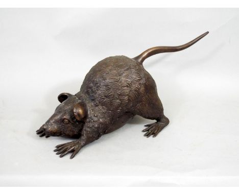 An oriental bronze figure of a pouncing rat, 37cm long 