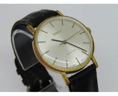 Vintage gents Tissot Stylist wristwatch, champagne dial, baton markers, 34mm case, period associated leather strap, currently