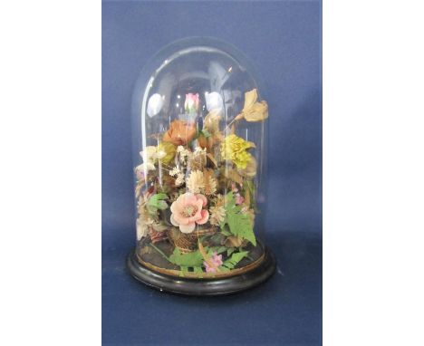 Vintage floral diorama under a glass dome with ebonised plinth stand, 37 cm high