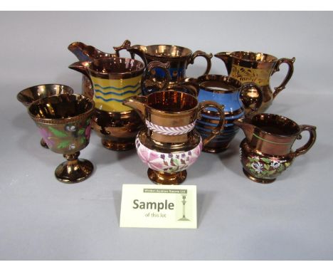 A quantity of 19th century and later ceramics including a number of copper lustre jugs of various size, a Spode comport of ci