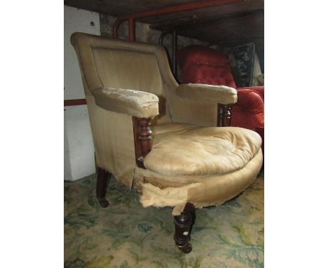 A Victorian drawing room chair with upholstered seat, back and arm pads raised on showwood turned mahogany supports with simu