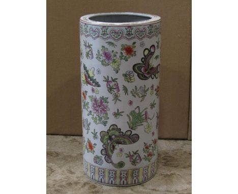 An oriental ceramic umbrella stand of cylindrical form with exotic butterfly and floral detail, 23 cm in diameter x 47 cm in 