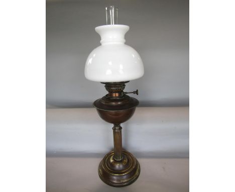 Brass Corinthian oil lamp with opaline glass shade, 64cm high including flue 