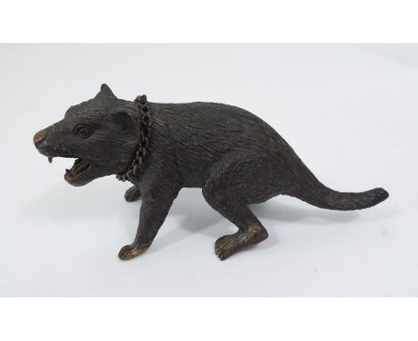 A bronze figure of a snarling animal, 13 cm in length 