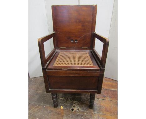 19th century campaign commode with folding framework and detachable legs, folding backs enclosing two folding arms and cane w