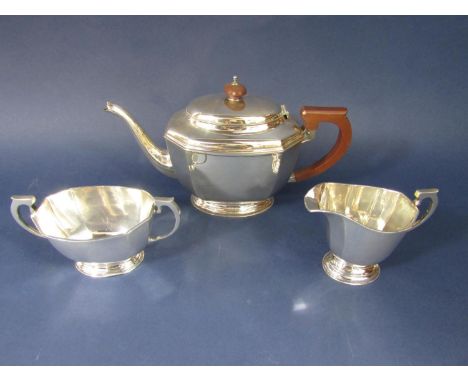 1930's Georgian style silver octagonal boat shaped tea service, comprising teapot, milk jug and sucrier, maker William Neale,