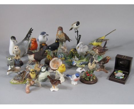 A collection of ceramic models of birds including USSR model of a gull, Border Fine Arts model of a wagtail, Royal Crown Derb