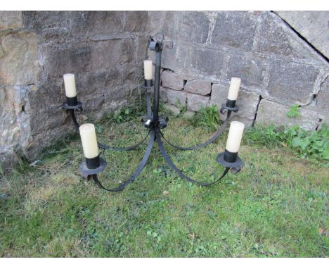 A sprung iron work five branch hanging ceiling light with simple scrolled detail 