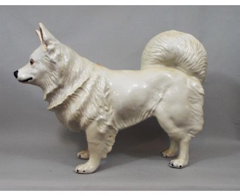 Ceramic figure of a hound with glass eyes, in standing position, 35 cm height 