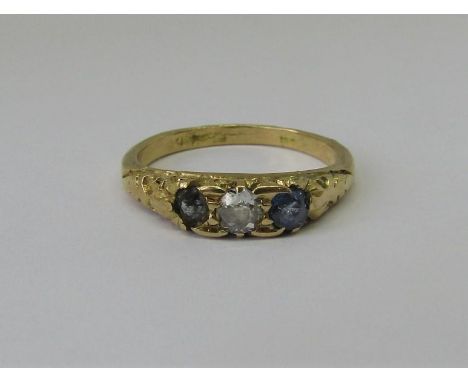 Three stone sapphire and diamond ring in yellow metal, size K, 3g (one blue stone paste replacement) 