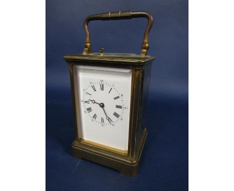 Brass cased repeater carriage clock, the enamel dial with roman and Arabic numerals, striking on a bell, 13.5cm high 