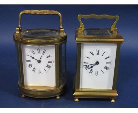 An oval brass cased carriage clock, together with a further square example, both 11.5cm high (2) 