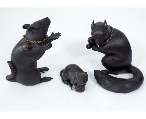 Japanese bronze figure of a standing rat, further smaller bronze rat clasping a nut and a bronze squirrel clasping a fruit, 1
