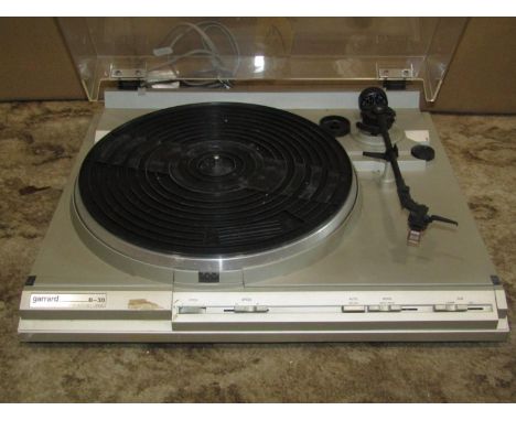 A Garrard B-30 semi auto belt drive record player, together with a quantity of LPs 