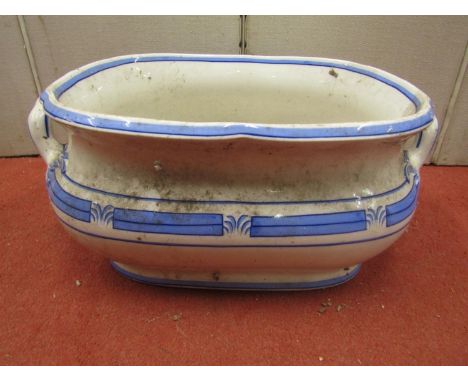 A Victorian ceramic foot bath with oval form with blue and white colourway with loop handles 