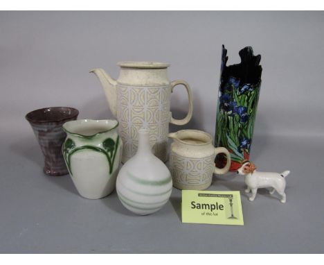 A collection of ceramics including Surrey ceramics pottery coffee wares with Celtic style decoration on an oatmeal coloured g