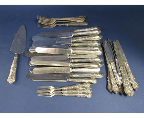 A large collection of white metal and silver flatware, comprising a set of 14 German white metal handled table knives, the bl