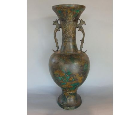 Chinese patenated bronze bottle neck baluster vase with twin scrolled bird head handles and embossed banded decoration to the