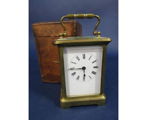Brass cased carriage clock, 11cm high, with Morocco leather carry case and key 