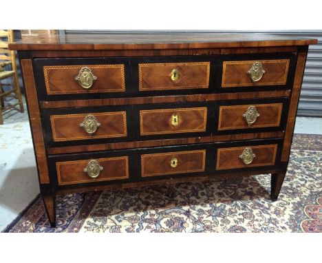 A 19th Century French walnut and marquetry cross-banded commode chest of three long drawers, raised to square tapered legs, h