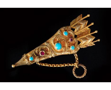 A 19th Century memorial brooch modelled as a quiver and three arrow heads set with turquoise and rubies, the hinged arrow hea