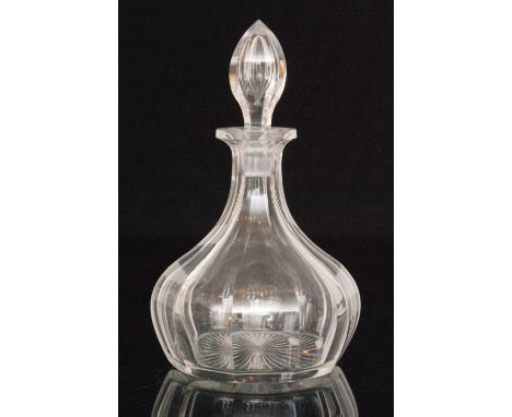 A 19th Century clear crystal glass decanter of swollen ovoid form with drawn collar neck and hollow blown stopper all with a 